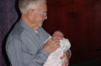 Otho Earl Jones holding grandchild